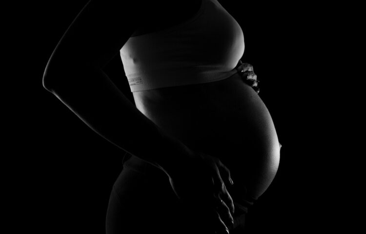 Gray scale Photo of a Pregnant Woman