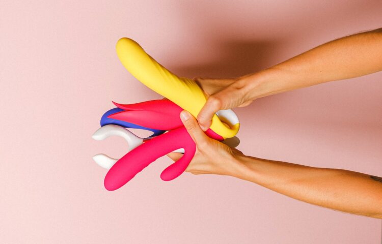 Hands Holding Sex Toys