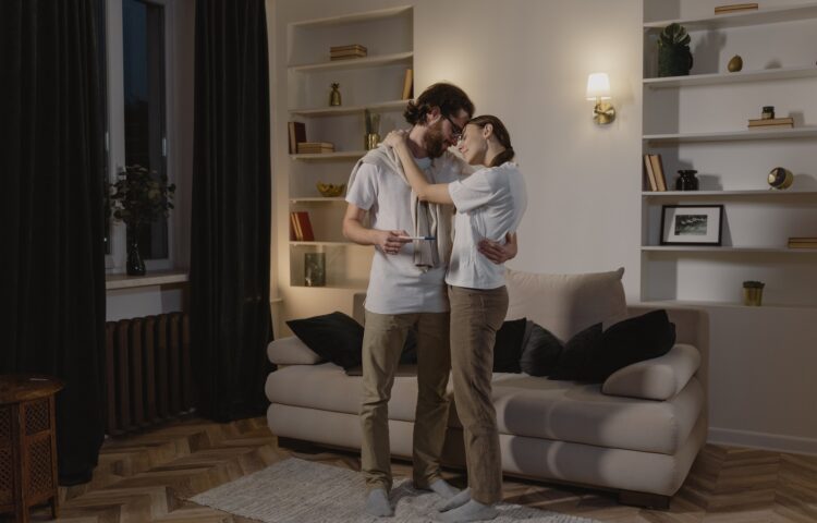 Couple Hugging Each Other in the Living Room